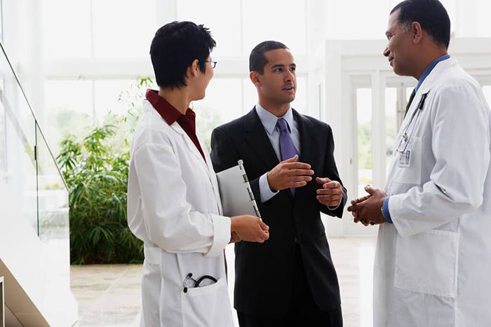 Doctors meeting with businessman
