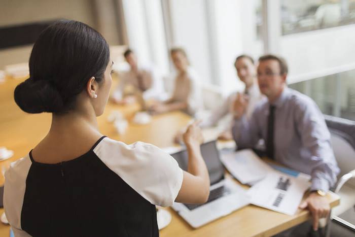 Businesswoman leading meeting