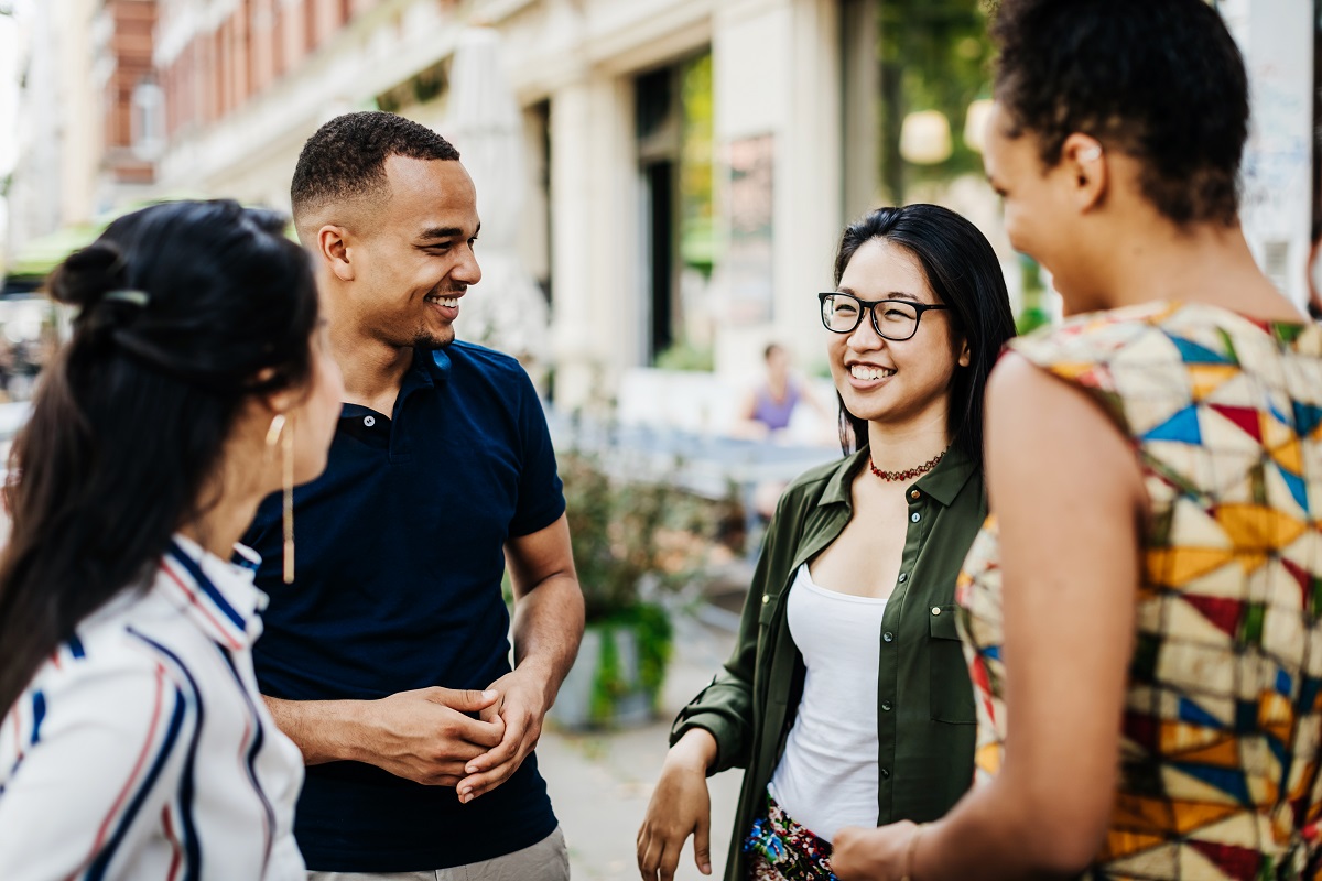 Group of friends laughing and smiling outside