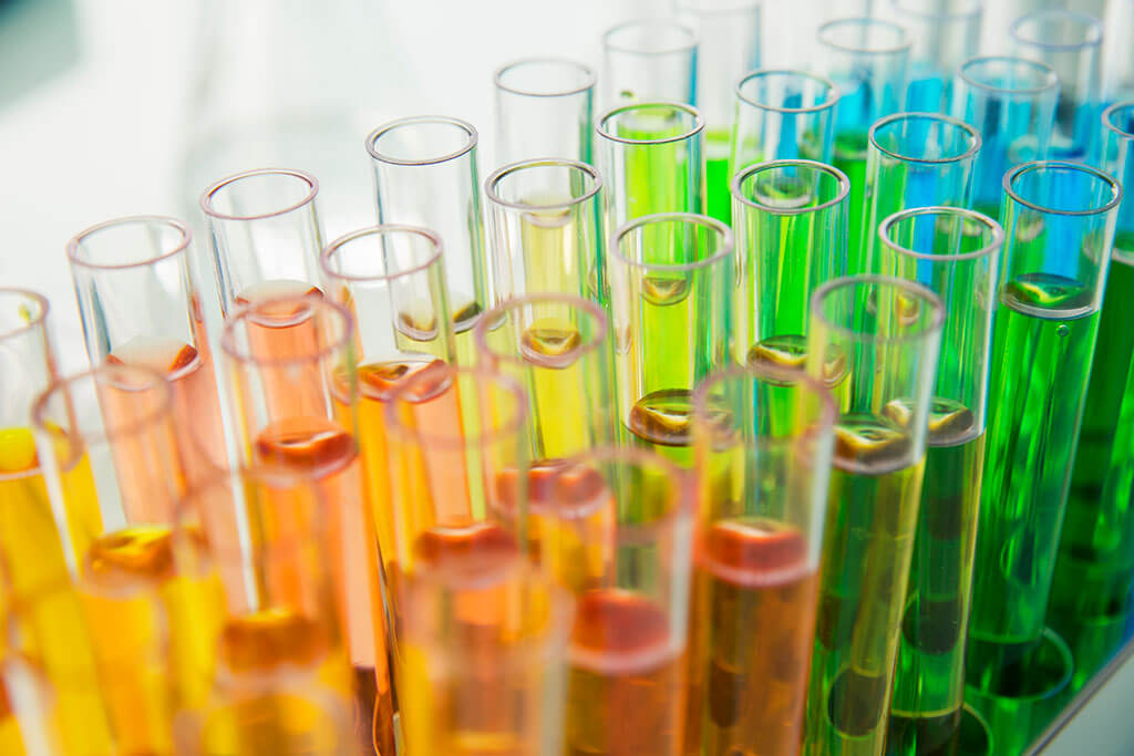 Rack of test tubes with solution in lab