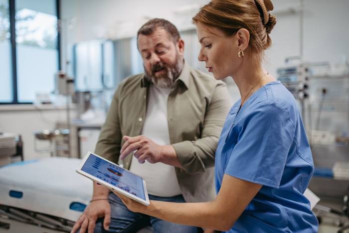 Female doctor consulting with patient